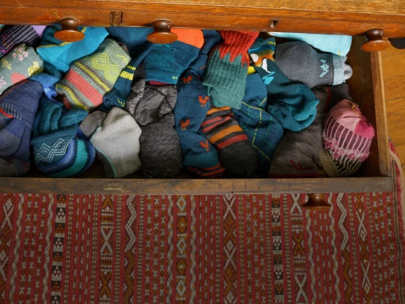 A drawer full of colorful socks